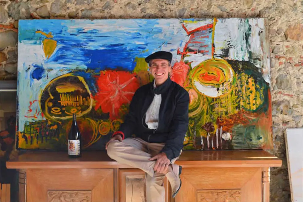 Pierre Fabre with one of his paintings