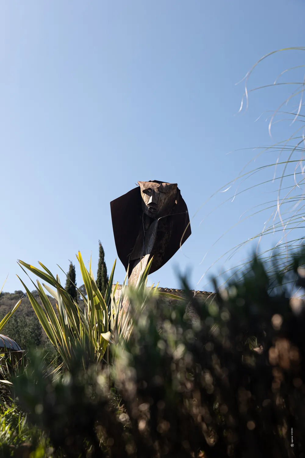 A metal sculpture among the estate's grasses