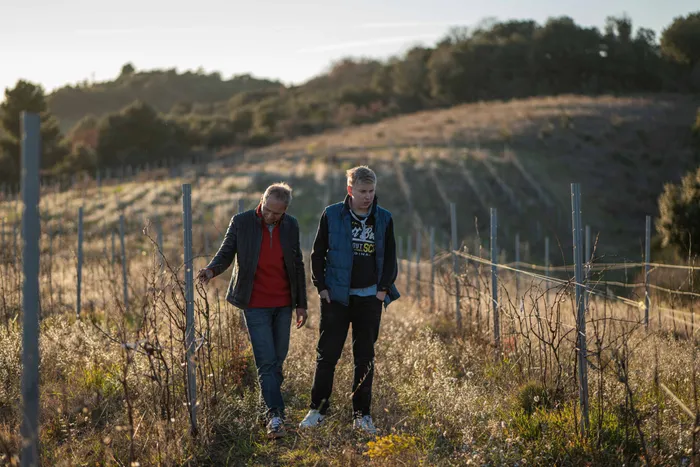 Pierre Fabre walking the Gaure vines with his son